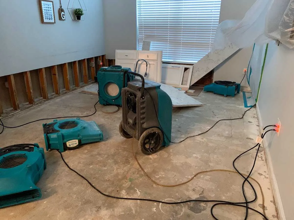 Dehumidifier in flood-cut room for Water Damage Restoration in Dunn Loring